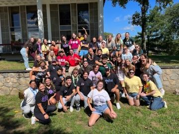 Greek Life members gathered together in group photo on the quad